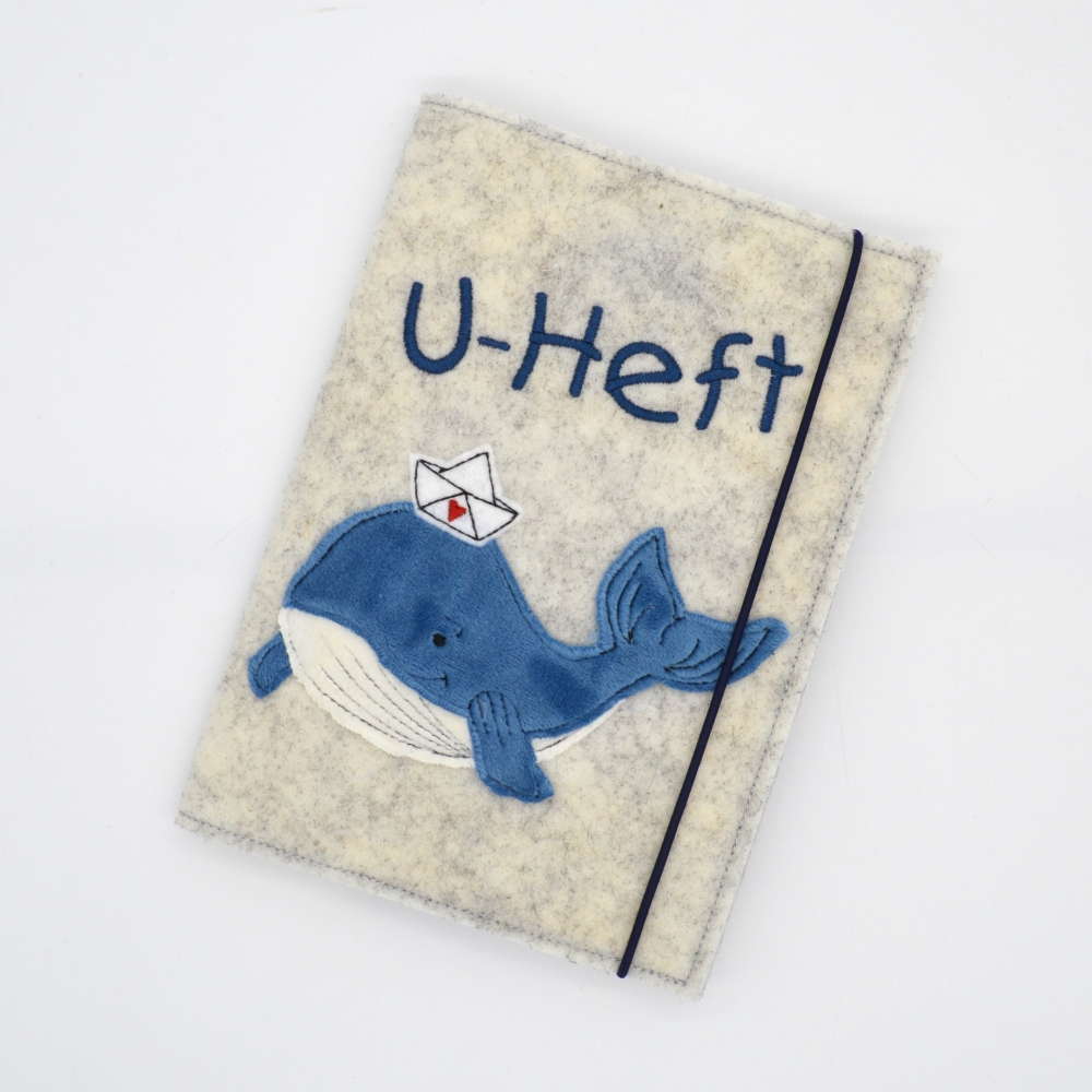 Bild 1 von U-Hefthülle aus Filz mit Wal und kleinem Boot  / (Variante) mit Schriftzug 